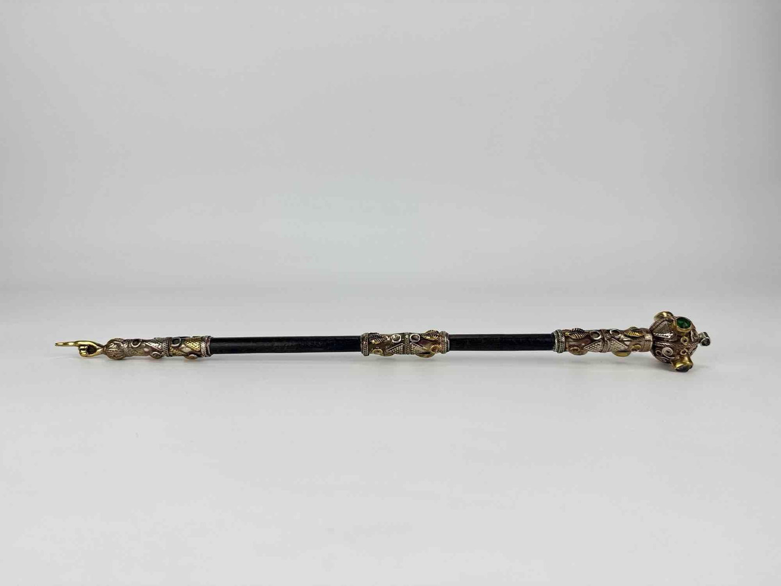 ANTIQUE ORNATE SILVER AND GEM SET JUDAICA TORAH POINTER YAD: Antique filigree parcel-gilt silver Judaica Torah pointer with bezel-set stones and a hand-form terminal. Approximate Dimensions: 1.5" W X 14.5X' L Artist or Maker: Unknown Provenance: From a 