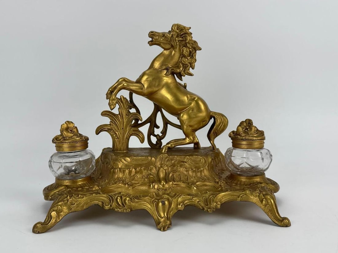 FRENCH GILT METAL STALLION DOUBLE INKWELL SIGNED "A. BOSSU": Late 19th to early 20th-century French Rococo style gilt spelter/metal double inkwell, featuring a centrally sculpted rearing stallion set before acanthus leaves, flanked by two clear glass inkwell in