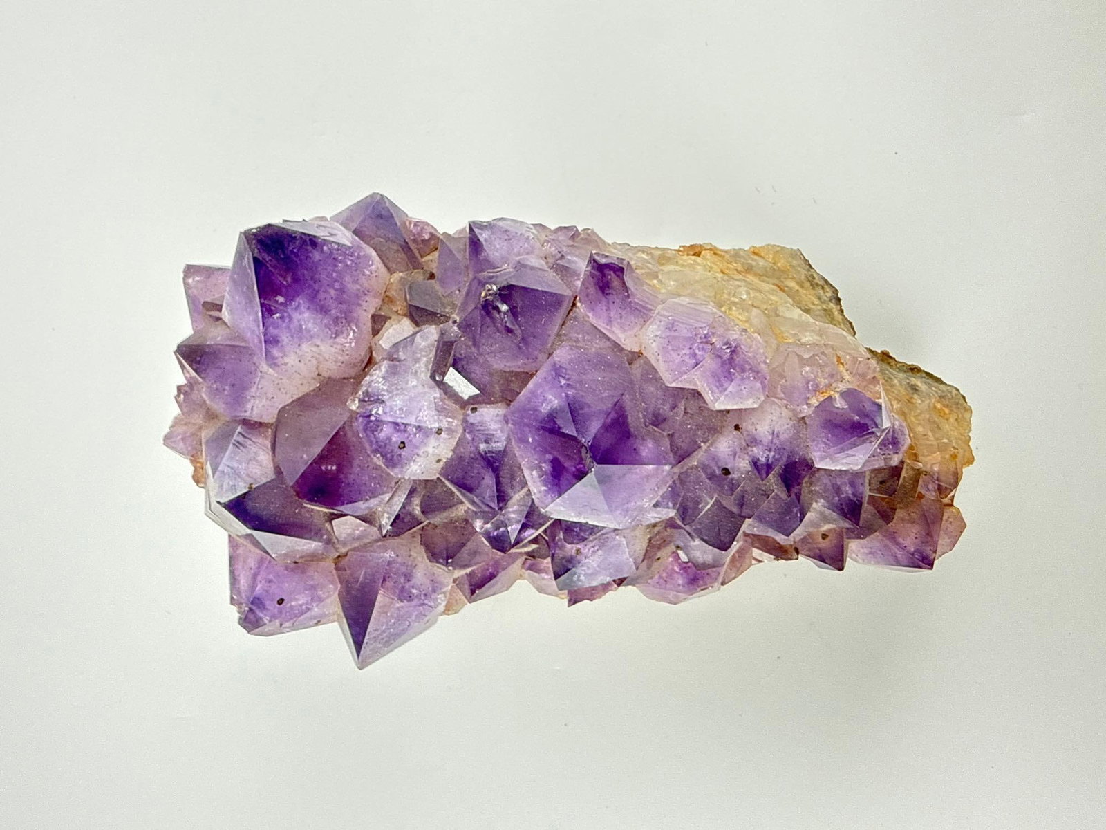 LARGE NATURAL URUGUAYAN PURPLE AMETHYST CRYSTAL CLUSTER SPECIMEN: Raw natural deep purple amethyst crystal cluster on original rock matrix. Approximate Dimensions: 7” x 4 x 3.5 Artist or Maker: Unknown Provenance: A New York Collector