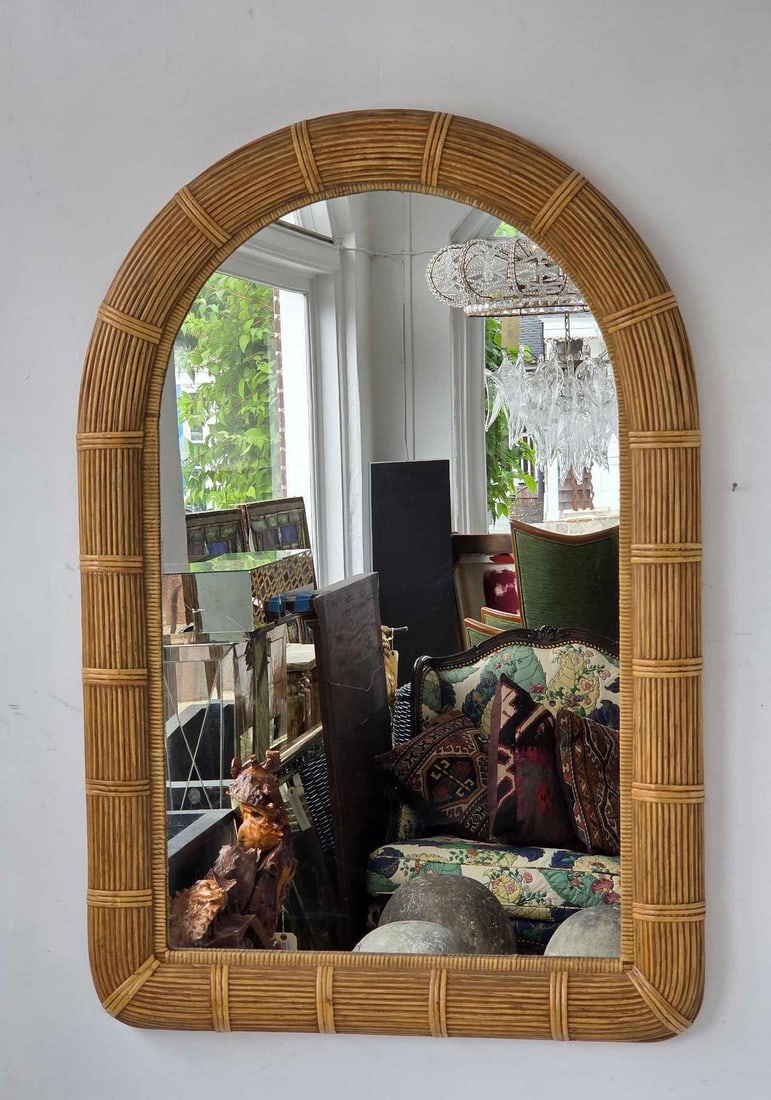 VINTAGE ARCHED SPLIT REED AND RATTAN WALL MIRROR IN THE STYLE OF GABRIELLA CRESPI: Vintage 1970s coastal modern arched wall mirror with a textured split reed and bound rattan frame. Approximate Dimensions: 41.75" H X 28" W Artist or Maker: Unknown Provenance
