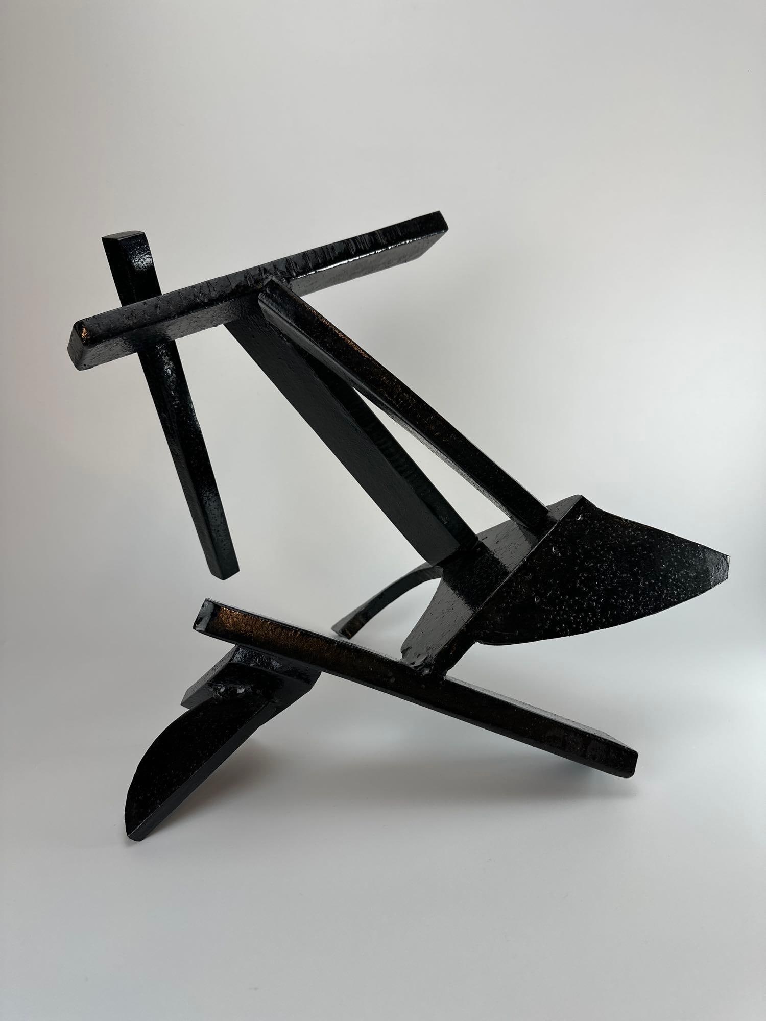JAMES T. GRECO ABSTRACT CONTRUCTIVIST WELDED STEEL SCULPTURE: Abstract welded steel sculpture of intersecting angular bars and planes in black finish, by James T. Greco Approximate Dimensions: 14" H x 12" W x 12" D Artist or Maker: James T. Greco Pro