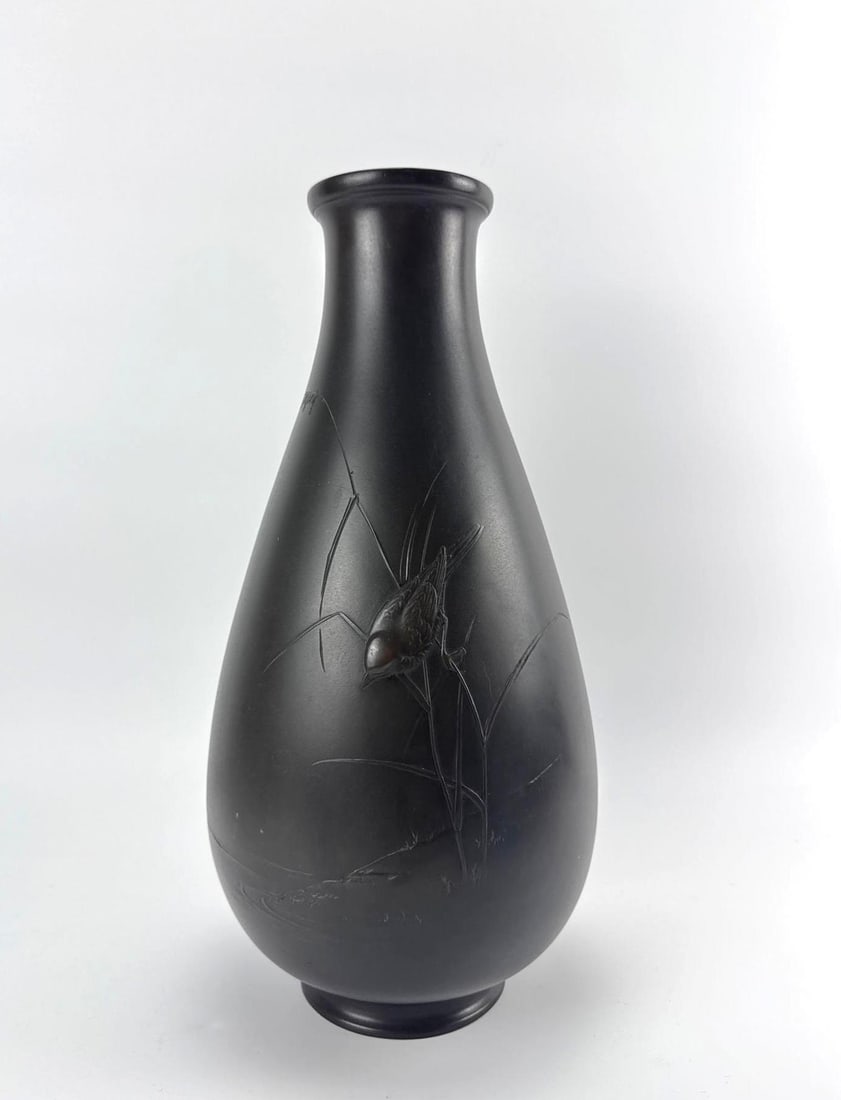SIGNED JAPANESE LIKELY MEIJI PATINATED BRONZE VASE WITH BIRD AND REED RELIEF MOTIF: Japanese patinated bronze vase . Approximate Dimensions: 16.5" H x 8.5" Dia. Artist or Maker: Unknown Provenance: From a New York Collector Notes: Although care is taken to photograph and desc