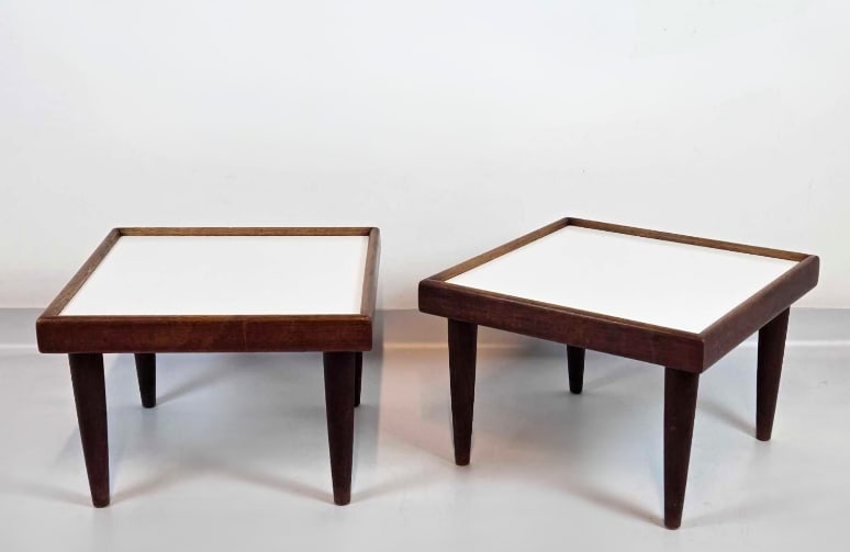 PAIR MID CENTURY WALNUT LOW TABLES WITH WHITE LAMINATE INSETS: Pair of mid century walnut low side tables with inset white laminate tops on tapered legs Approximate Dimensions: 12.75" H x 18.5" W x 18.5" D each Artist or Maker: Unknown Provenance: