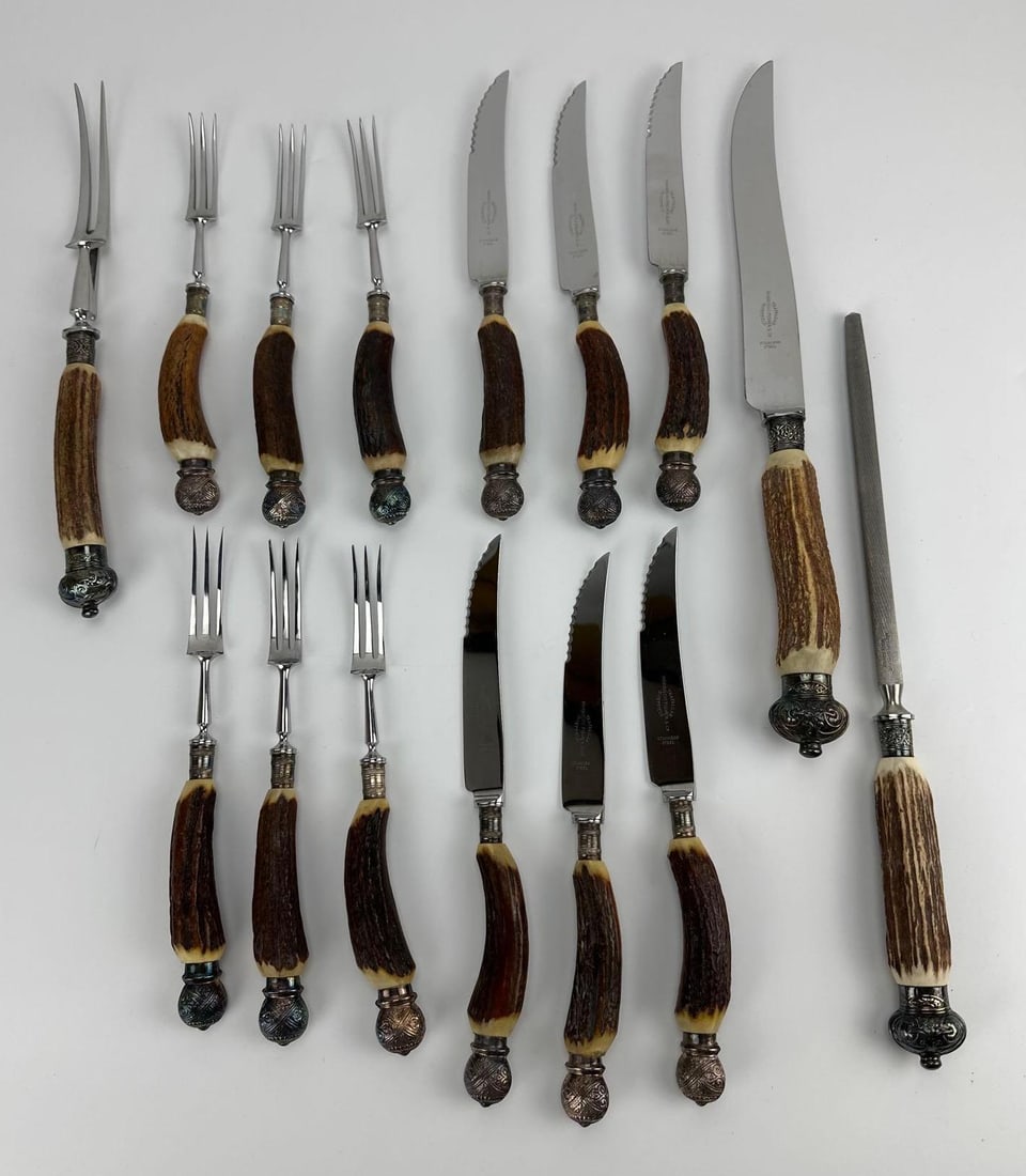 HARRISON FISHER ANTLER HANDLE STEAK & CARVING SET: Set of staghorn/antler handle steak knives and forks with silver-mounted handles and stainless blades, by Harrison Fisher Approximate Dimensions: knives approximately 13" L each Artist or Maker: H
