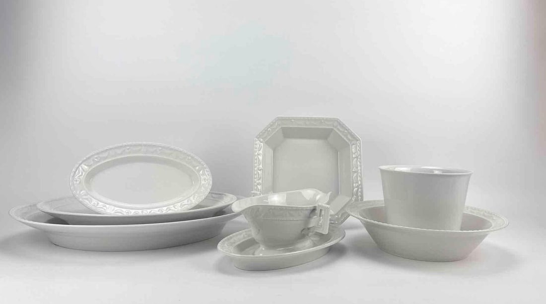 SEVEN PIECE KPM WHITE PORCELAIN SERVING GROUP PLATTERS TUREENS: Seven piece white glazed porcelain serving group with graduated platters, covered dishes and cup, blue underglaze mark Approximate Dimensions Largest Item: 2" H x 16" W x 12.5" D Artist or