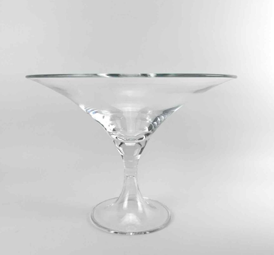 MONUMENTAL CLEAR GLASS PEDESTAL CENTERPIECE BOWL: Large clear glass centerpiece bowl of flared conical form on tall pedestal stem Approximate Dimensions: 11.5" H x 16" Dia. Artist or Maker: Unknown Provenance: From a New York Collector Notes:
