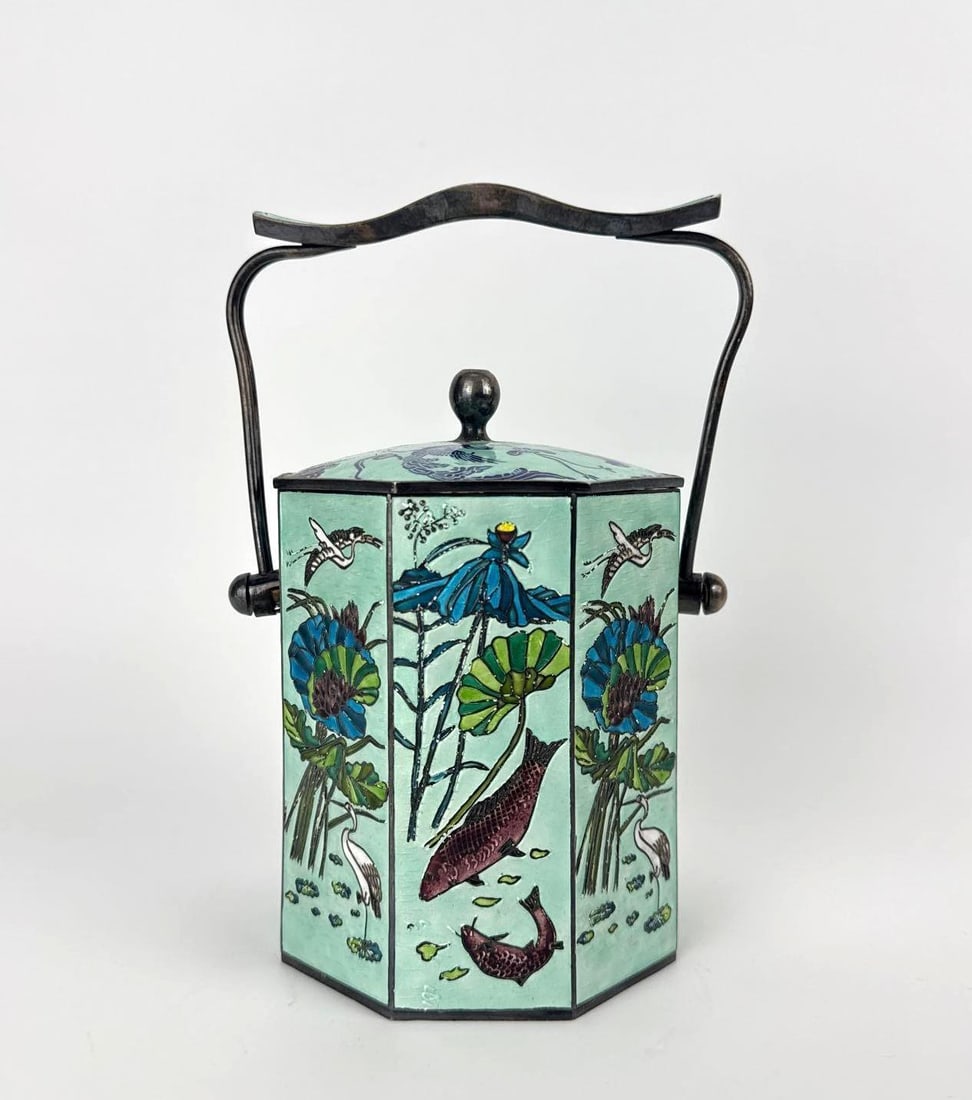 VINTAGE CHINESE CLOISONNÉ ENAMEL BIRD-AND-FLOWER ICE BUCKET: Hexagonal enameled ice bucket with swing handle, celadon ground with bird-and-flower decoration and metal liner. Approximate Dimensions: 6.5" H X 6" W X 5" D Artist or Maker: Unknown; Chin