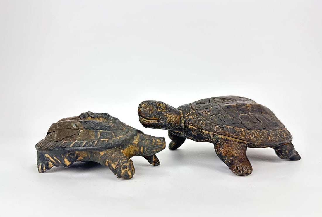 BRONZE-CLAD CHINESE ARCHAISTIC MOTHER AND BABY TURTLE FIGURES, PAIR: Two naturalistic bronze-clad turtle figures, a larger and a smaller. Approximate Dimensions Larger: 2.25" H X 5" W X 6" D Artist or Maker: Unknown Provenance: From the estate of a prominen
