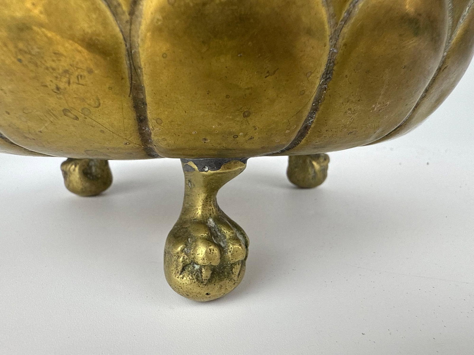 TWO REPOUSSE BRASS FOOTED CACHEPOTS - 9