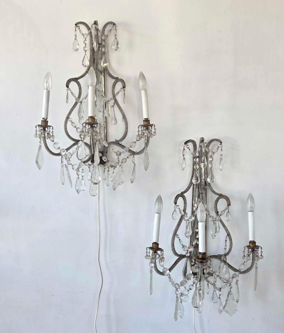 PAIR VINTAGE GILT METAL MIRRORED THREE LIGHT CRYSTAL BEADED SCONCES: Pair of vintage gilt metal three light wall sconces with mirrored backplates, crystal drops and beaded swags Approximate Dimensions: 24" H x 17" W x 11" D each Artist or Maker: Unknown Pro