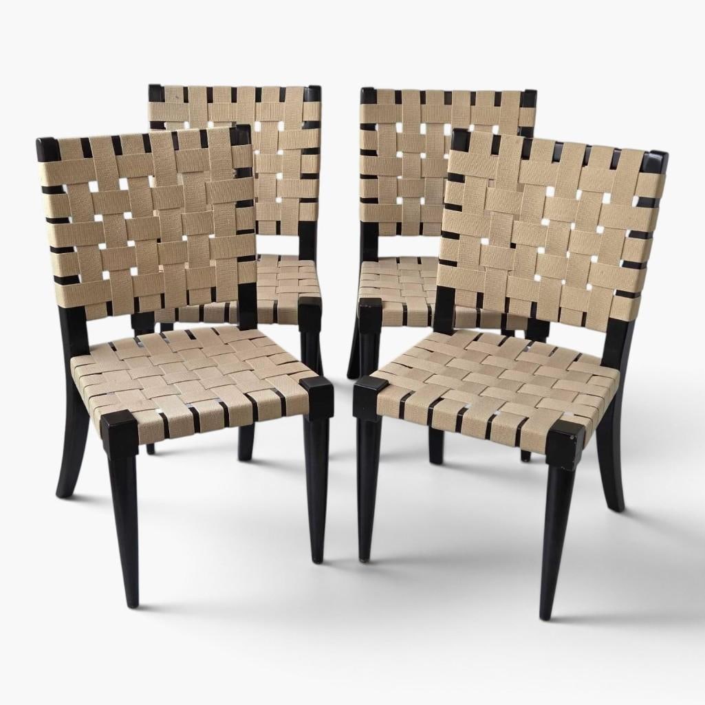 SET OF FOUR WEBBED NIEDERMAIER EBONIZED WOOD AND CANVAS-STRAP SIDE CHAIRS REMOVABLE CUSHIONS: Set of four webbed Niedermaier side chairs with ebonized wood frames and woven canvas-strap seats and backs with removable cushions Approximate Dimensions Each: 34" H X 19" W X 20" D Artis