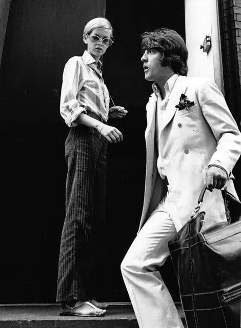 RON GALELLA TWIGGY & JUSTIN DE VILLENEUVE PHOTOGRAPH NEW YORK 1967: A framed black-and-white photograph, Twiggy and Justin de Villeneuve outside of Bert Stern's Studio, New York, 1967, by Ron Galella. Art Approximate Dimensions: 24" L x 15“ W Overall Approxi