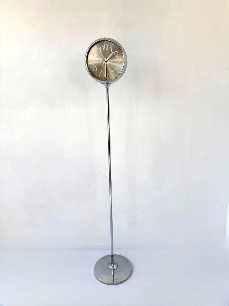 WALTHAM 1970S TALL CHROME FLOOR CLOCK: A tall, 1970s chrome floor-standing clock. Approximate Dimensions: 60” H Maker: Waltham Provenance: From a New York Collector Notes: Sold as-is, where-is. Please examine all photograp
