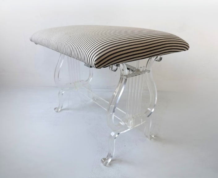 HOLLYWOOD REGENCY LUCITE BENCH BY GROSFELD HOUSE: Lucite bench with lyre base Approximate Dimensions: 27” x 19” x 21”h Artist or Maker: Grosfeld House Provenance: From a New York Collector Notes: Sold as-is, where-is. Please examine