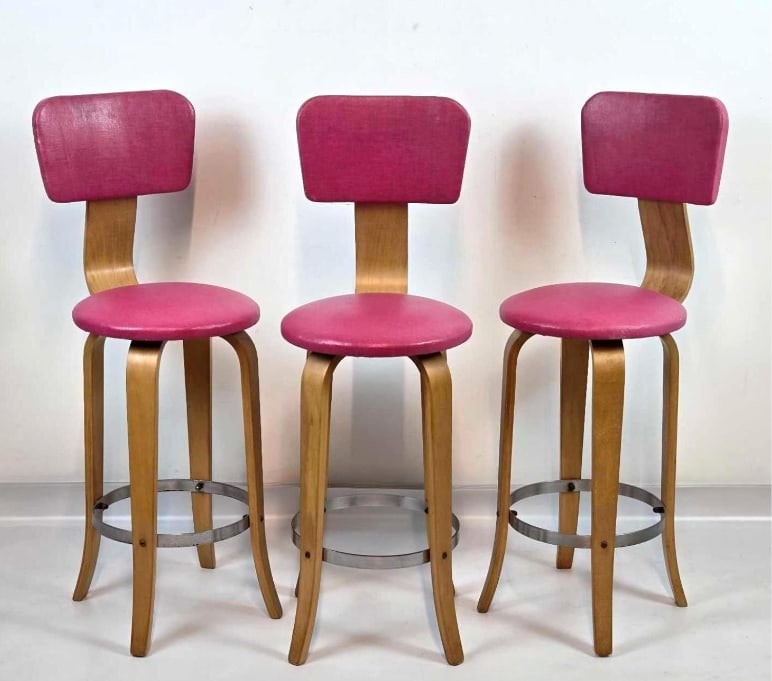 TRIO OF PINK FAUX LEATHER UPHOLSTERED BENTWOOD STOOLS: *A set of three, mid-century modern blonde bentwood barstools with bright pink vinyl upholstered seats and backrests. Approximate Dimensions: 38" H x 13.5" W x 18" D / Seat height 24" 