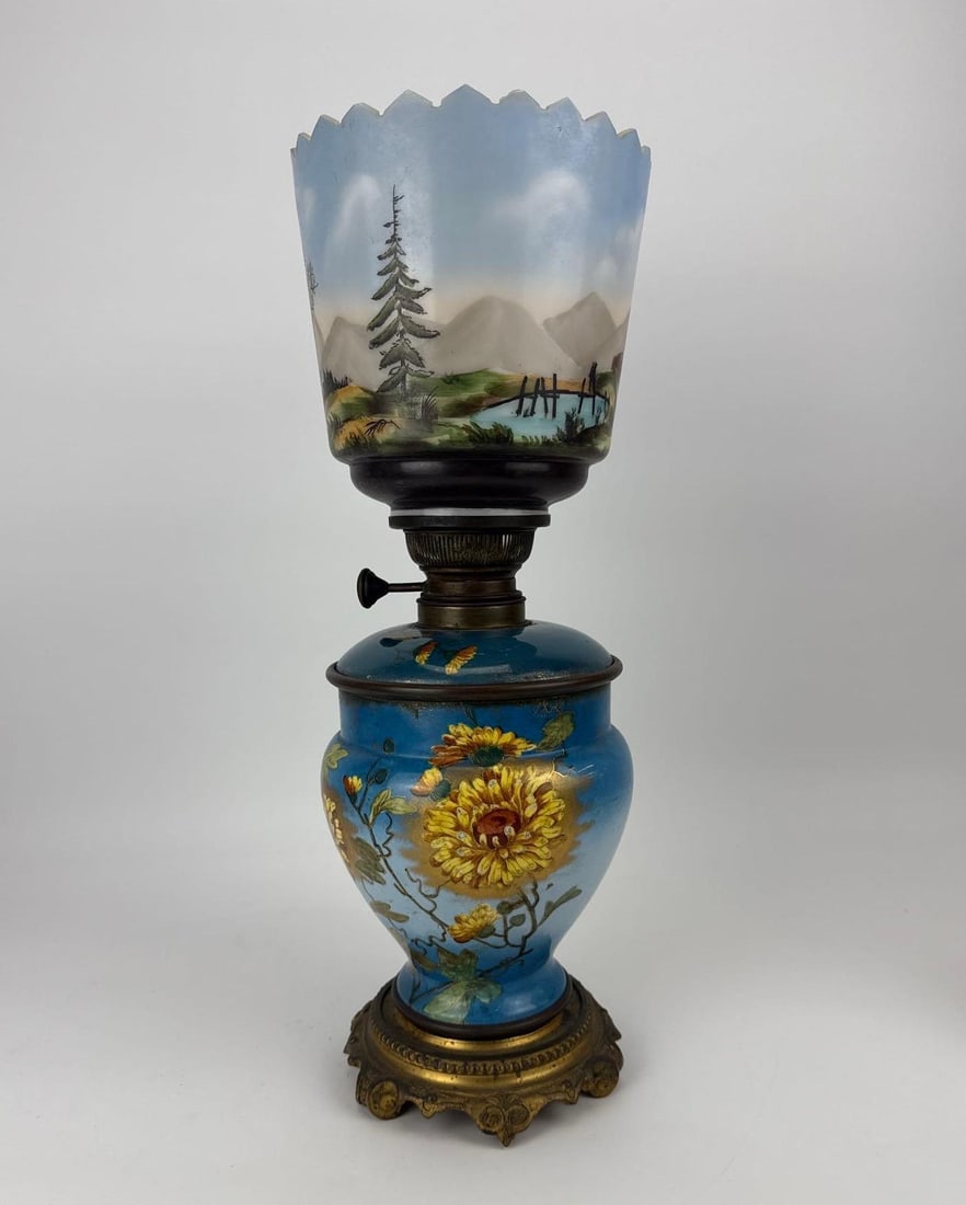 ANTIQUE VICTORIAN HAND-PAINTED BLUE OPALINE GLASS PARLOR OIL LAMP: *Late 19th-century Victorian parlor kerosene oil lamp featuring hand-painted blue opaline glass with a yellow floral motif on the base and a detailed country church landscape scene on the ruffled shad