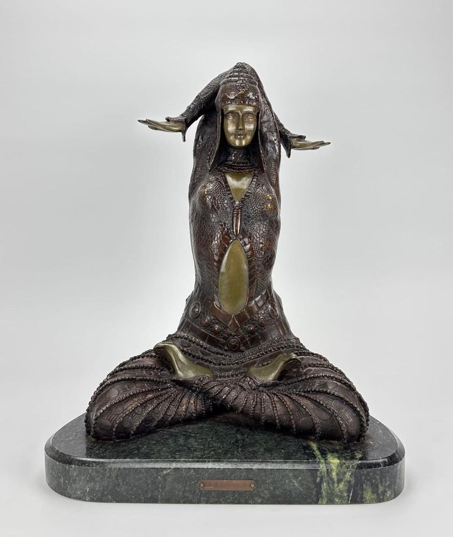 ANTIQUE STYLE BRONZE SEATED WOMAN SCULPTURE INSCRIBED D.H. CHIPARUS: *Patinated cast bronze figure after Demetre Chiparus depicting an exotic dancer or deity in a cross-legged meditative yoga posture mounted on a contoured green marble base with an inscribed signature 