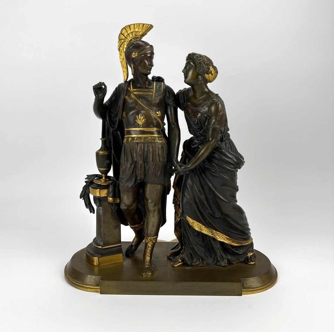 19TH-CENTURY FRENCH PATINATED AND GILT BRONZE VERSION OF A SCULPTURE BY HUZEL: *19th-century French classical bronze figural group by sculptor Huzel, titled "Aeneas Taking Leave of Dido", rendered in rich dark patinated bronze accented by fine gilded highlights. Approxim