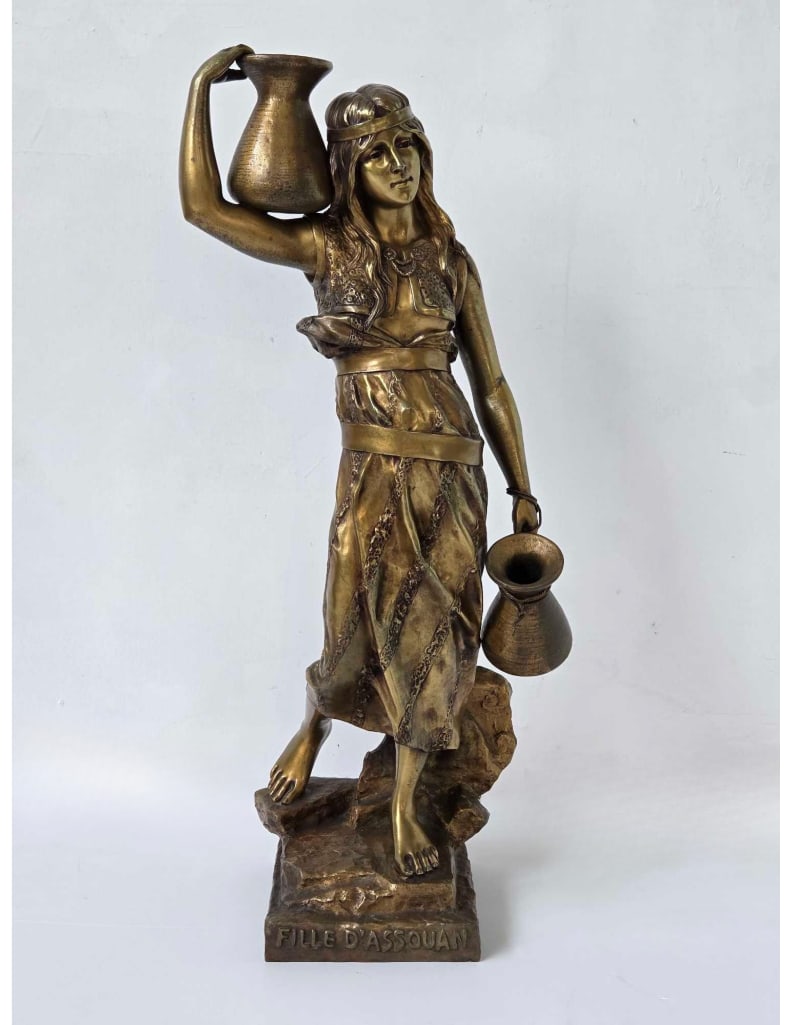 GEORGES CHARLES COUDRAY BRONZE SCULPTURE "FILLE D'ASSOUAN": *Large French Orientalist patinated bronze sculpture by Georges Charles Coudray (1862–1932), titled "Fille d'Assouan" (Girl of Aswan) Approximate Dimensions: 31.5" H X 14" W X 10