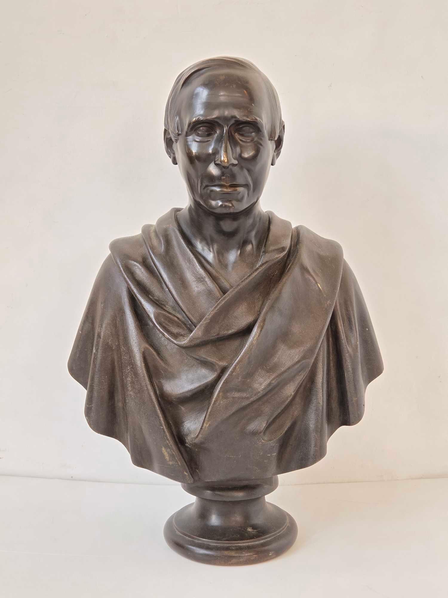 GRAND TOUR BRONZE BUST OF NICCOLO DA UZZANO OF FLORENCE: *Large 19th-century Italian Grand Tour patinated bronze portrait bust of Florentine statesman Niccolò da Uzzano set on a circular socle base, loosely modeled after the famous Renaissance terracotta s