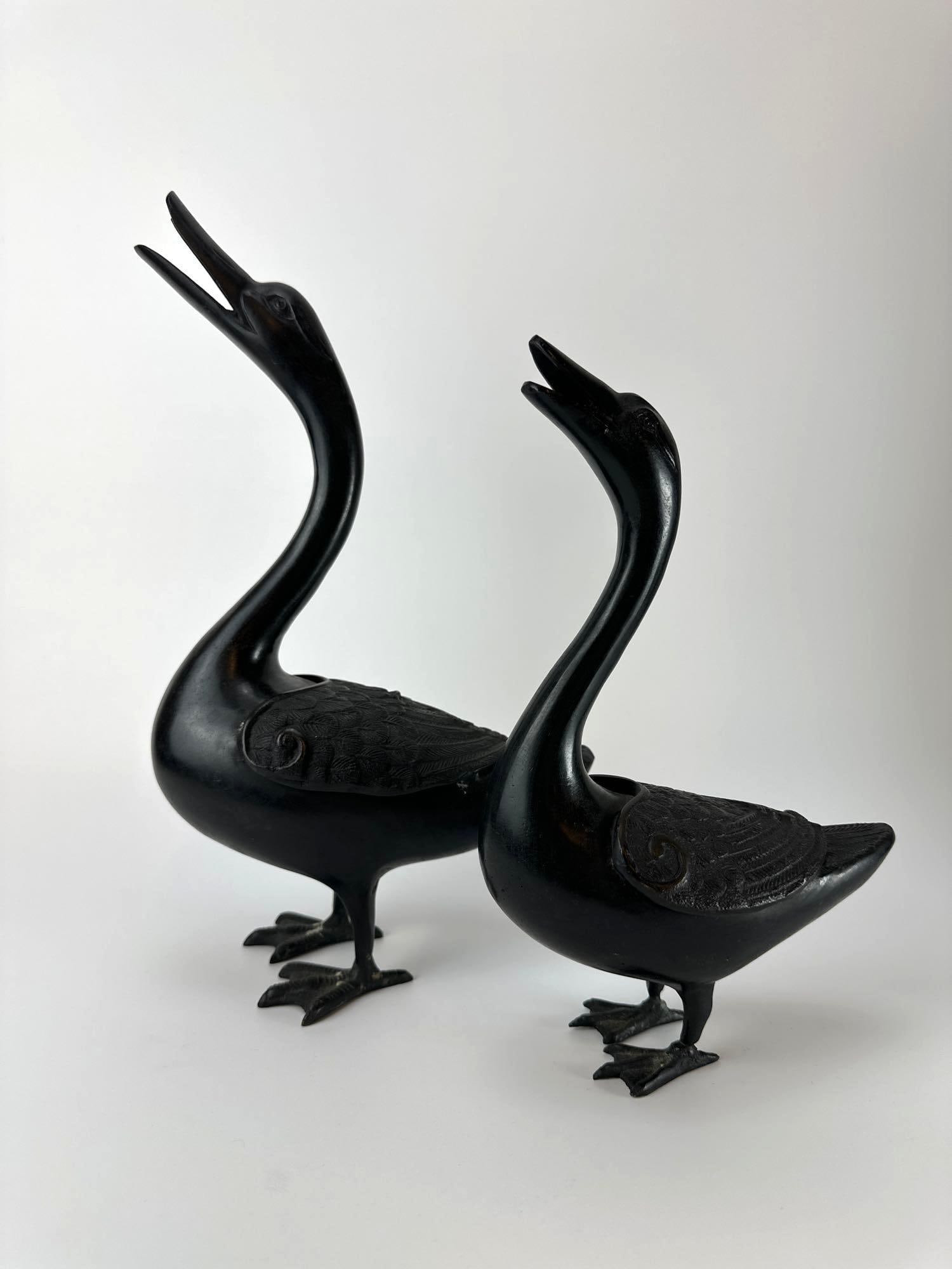 PAIR OF CHINESE QING STYLE ARCHAISTIC BRONZE DUCK FIGURES: *Pair of dark patinated bronze ducks. Approximate Dimensions: 9”x5”x14” Artist or Maker: Unknown Provenance: A New York Collector Notes: Although care is taken to photograph and desc