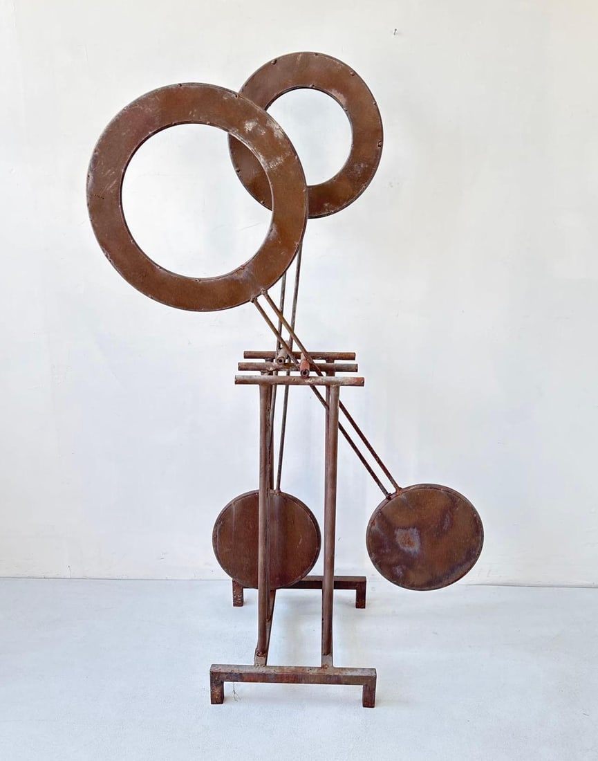 MODERNIST ABSTRACT WELDED IRON KINETIC SCULPTURE: Abstract welded iron sculpture with circular ring and disc forms on a stand with a rusted finish and patina Approximate Dimensions: 12" W x 13" D x 54" H Artist or Maker: Unknown Provenanc