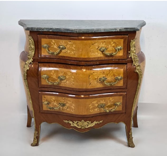 LOUIS XV STYLE INLAID BRONZE MOUNTED BOMBE MARBLE TOP COMODE: *Fine 20th-century continental Louis XV style three-drawer chest of drawers showcasing a serpentine bombe silhouette, elaborate floral marquetry fruitwood inlays, a contoured grey-veined serpentine ma