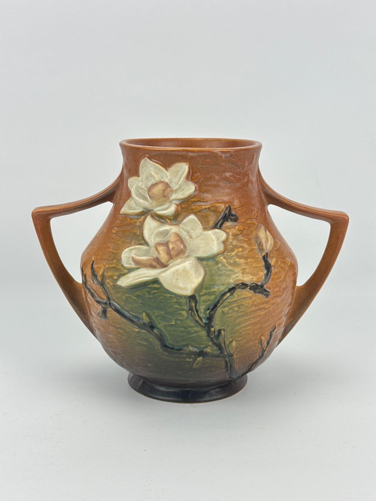 ROSEVILLE POTTERY MAGNOLIA 91-8 VINTAGE AMERICAN ART POTTERY DOUBLE HANDLED VASE: *Mid-century American art pottery double-handled vessel in the Magnolia pattern with textured brown and green background tones highlighting embossed white blossoms on gnarled branches Approximate Dime