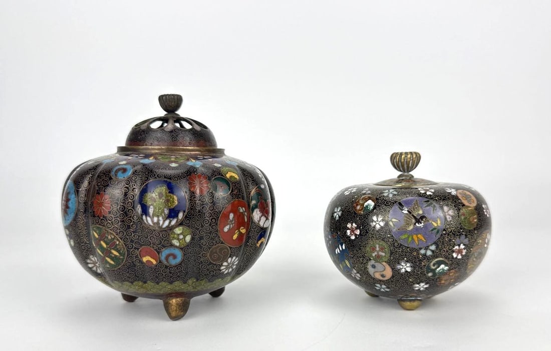 TWO JAPANESE CLOISONNE COVERED INCENSE BURNERS (CENSERS): Two Japanese cloisonne enamel covered incense burners on tripod feet Approximate Dimensions: taller 3.5" H x 3.5" Dia. Artist or Maker: Unknown Provenance: From a New York Collector Notes: Alt