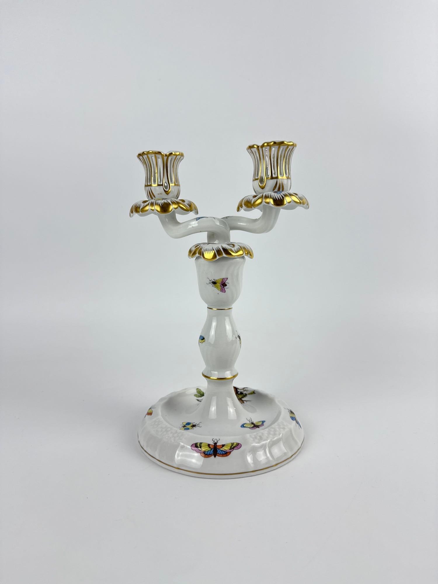 HEREND ROTHSCHILD BIRD PORCELAIN TWO-LIGHT CANDELABRUM: Herend hand-painted porcelain two-light candelabrum in the Rothschild Bird pattern with gilt accents. Approximate Dimensions: 8.75" H X 5.5" W X 5" Dia. Artist or Maker: Herend, Hungary (b