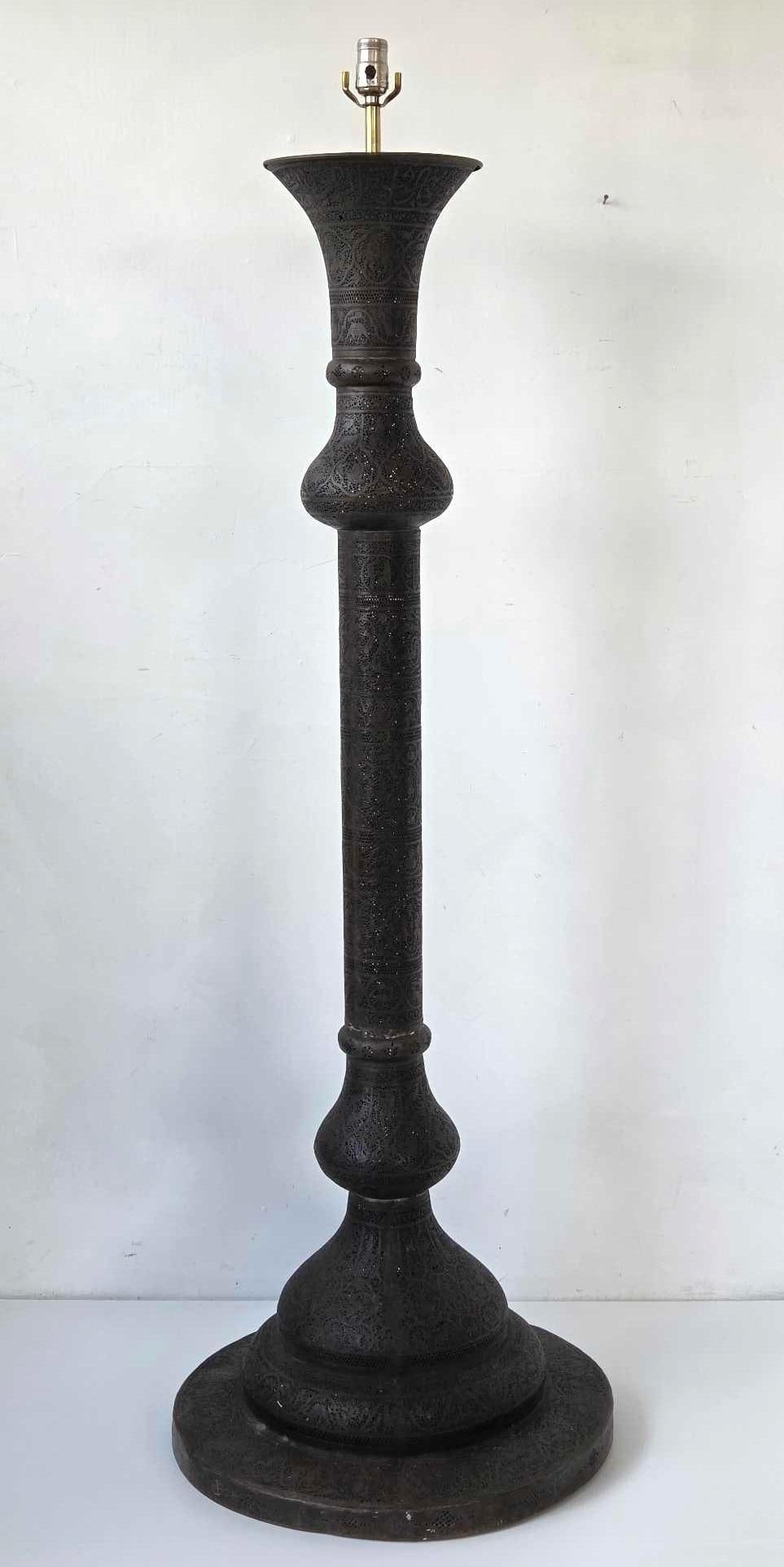 19TH CENTURY MIDDLE EASTERN PIERCED BRASS FLOOR LAMP: Middle Eastern pierced and engraved brass columnar floor lamp with foliate arabesque decoration on a domed foot. Approximate Dimensions: 61" H X 20" Dia. Artist or Maker: Unknown Provenance: F