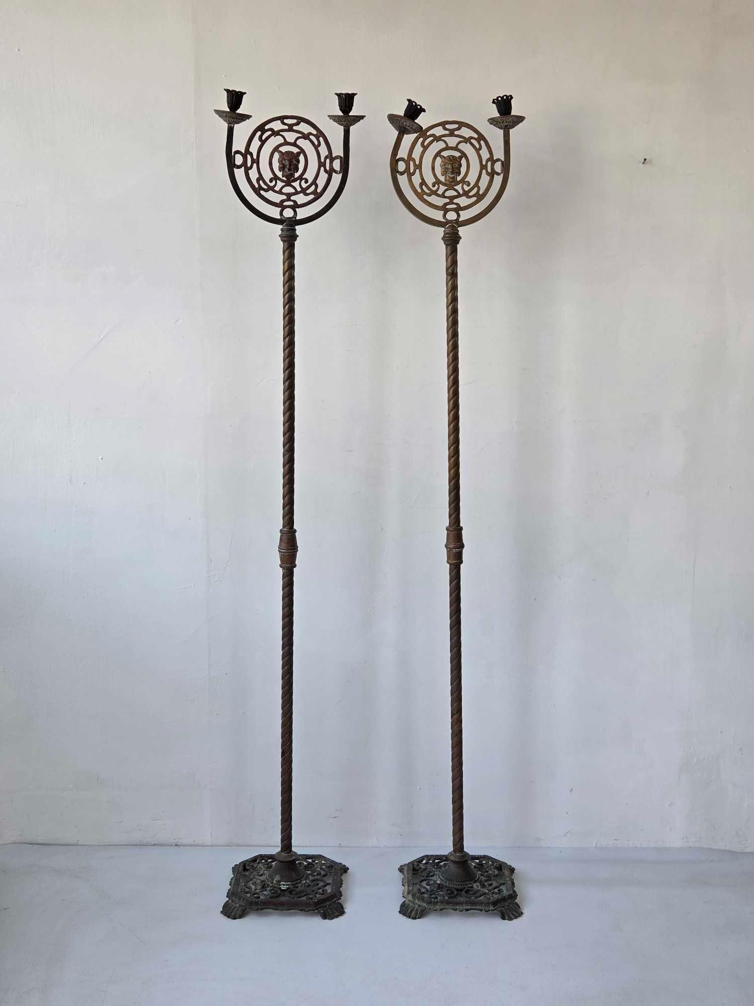 PAIR OF GOTHIC BRASS AND METAL FLOOR STANDING CANDELABRA: Ornate Floor candelabra pair Approximate Dimensions: 60" H X 11" W X 10" D Arist or Maker: Unknown Provenance: From a New York Collector Notes: Sold as-is. Condition commensurate with age 