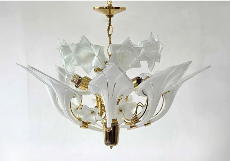 VINTAGE MURANO GLASS CALLA LILY CHANDELIER ATTRIBUTED TO FRANCO LUCE: Murano glass calla lily chandelier with clear glass leaves and blossoms on a brass frame Approximate Dimensions: 23" H x 30" Dia. Artist or Maker: Attributed to Franco Luce Provenance: From a 