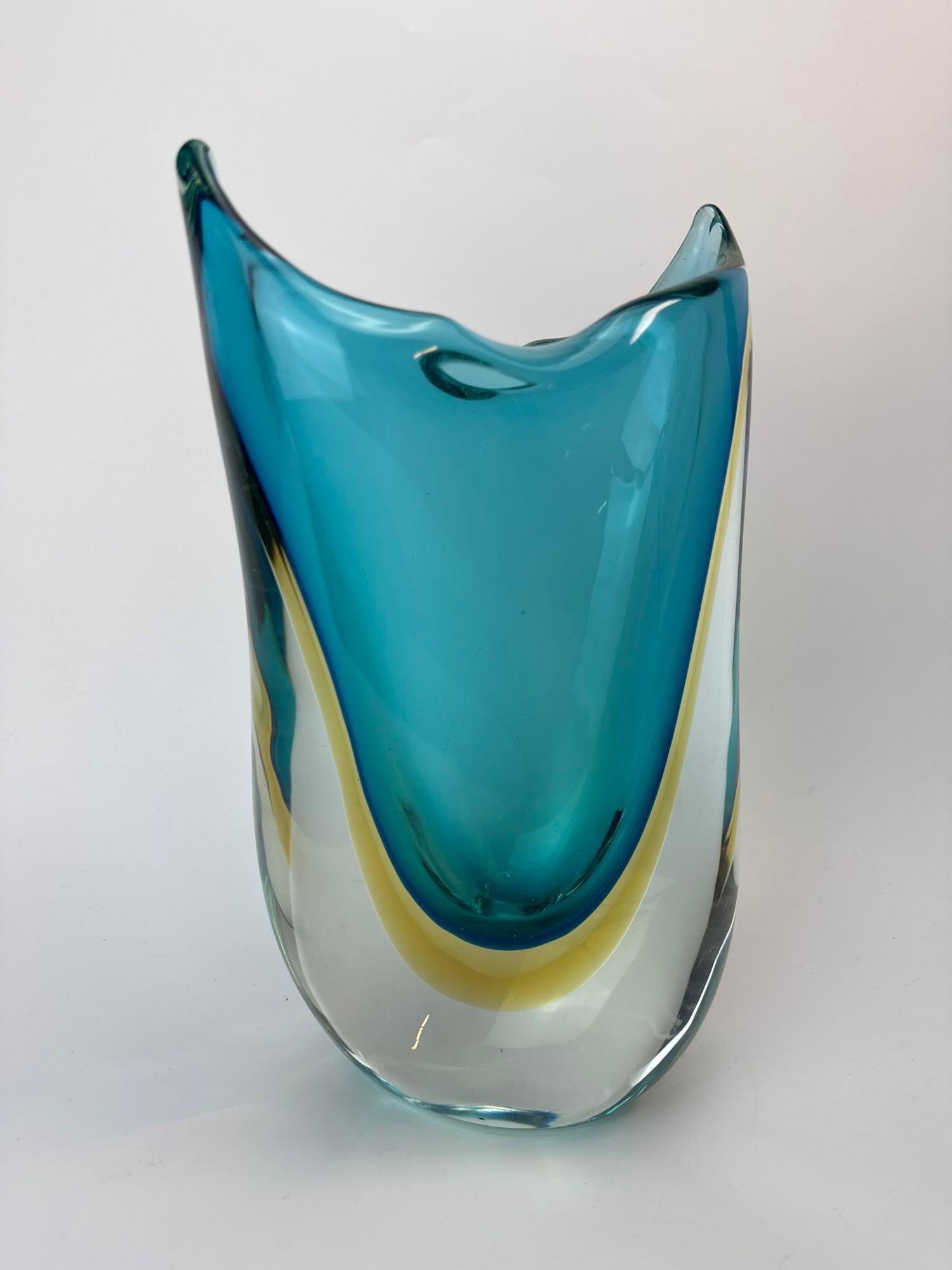 MURANO SOMMERSO ART GLASS VASE, ATTRIBUTED FLAVIO POLI FOR SEGUSO: Murano sommerso art glass vase, teal blue and amber cased in clear, upswept wing form with an undulating rim. Approximate Dimensions: 12" H x 6 1/2" W Artist or Maker: Flavio Poli for Seguso V