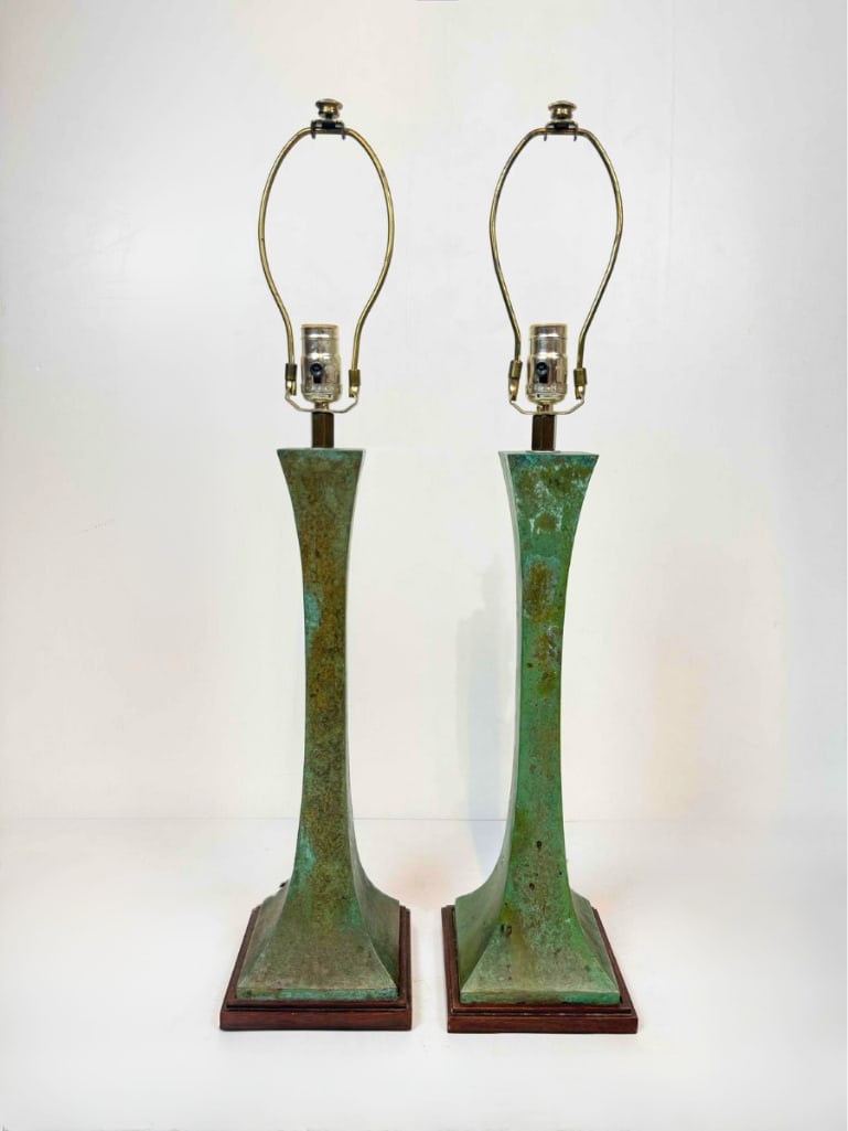 PAIR OF VERDIGRIS BRONZE COLUMN TABLE LAMPS, JEAN-MICHEL FRANK STYLE, WITH SHADES: Pair of verdigris patinated bronze table lamps, waisted square tapering column on a stepped plinth base, with rectangular off-white shades Approximate Dimensions: 30 1/2" H x 6 1/4" W Artist o