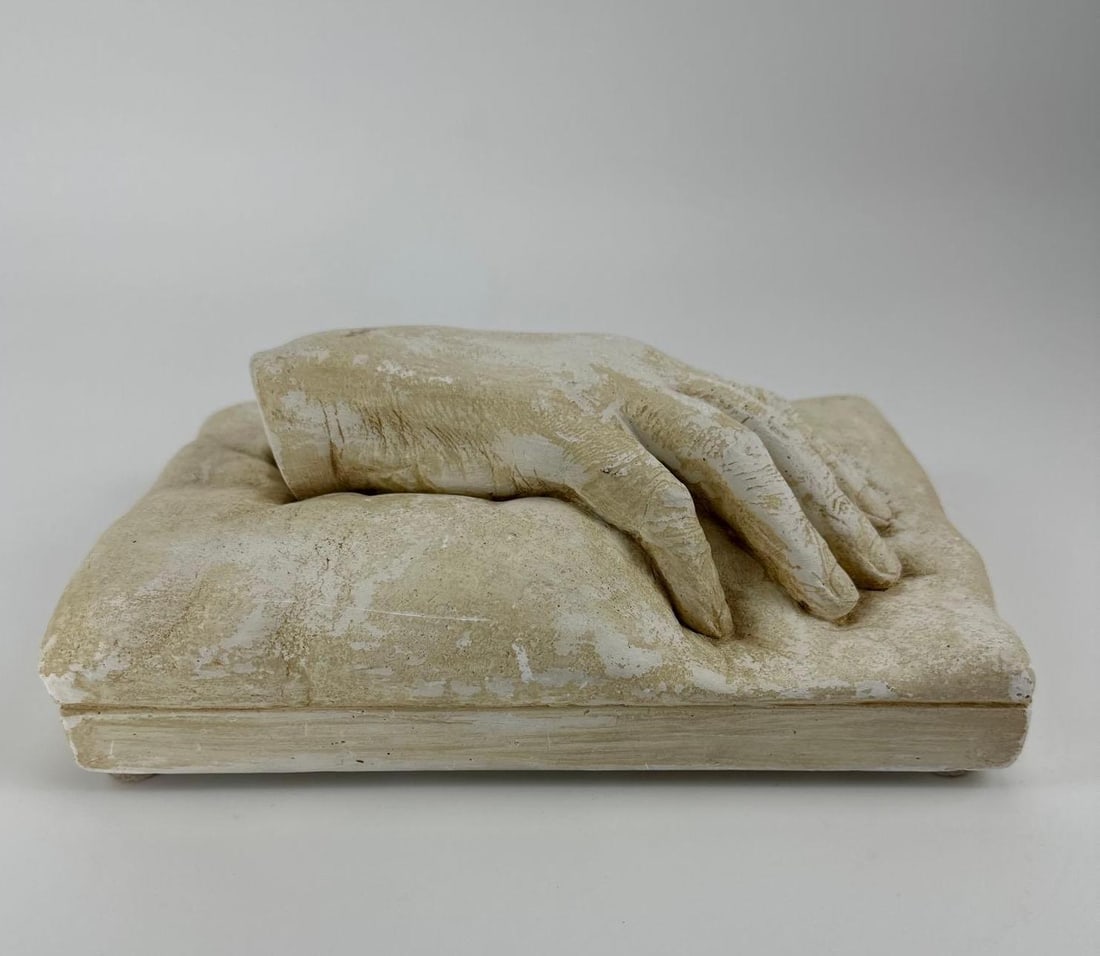 SIGNED CAST SCULPTURE OF A HAND ON PLINTH, HASA, CZECH: Plaster sculpture of a life size right hand resting palm down on a rectangular plinth, incised signature to the plinth edge. Approximate Dimensions: 4" H x 10" L x 7" W Artist or Maker: HA