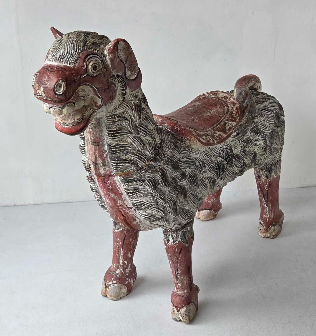 LARGE CARVED POLYCHROME WOOD MYTHICAL BEAST TEMPLE GUARDIAN, BALINESE KIRIN: Large carved wood figure of a mythical guardian beas. Approximate Dimensions: 36" H x 45" W x 10" D Artist or Maker: Unknown carver. Bali, Indonesia, per consignor. There is no signature, 
