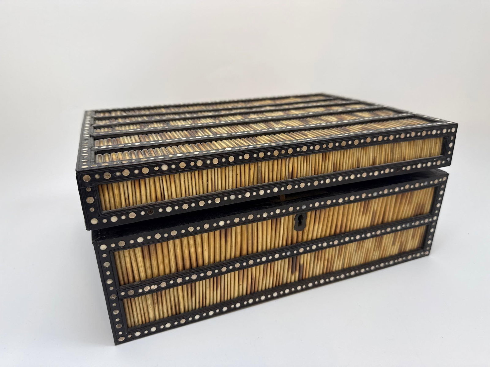 ANGLO-INDIAN PORCUPINE QUILL BOX (CEYLONESE): Anglo-Indian porcupine quill and inlaid box with a fitted interior Approximate Dimensions: 5.5" H x 12.25" W x 9" D Artist or Maker: Unknown Provenance: From a New York Collector Notes: Al