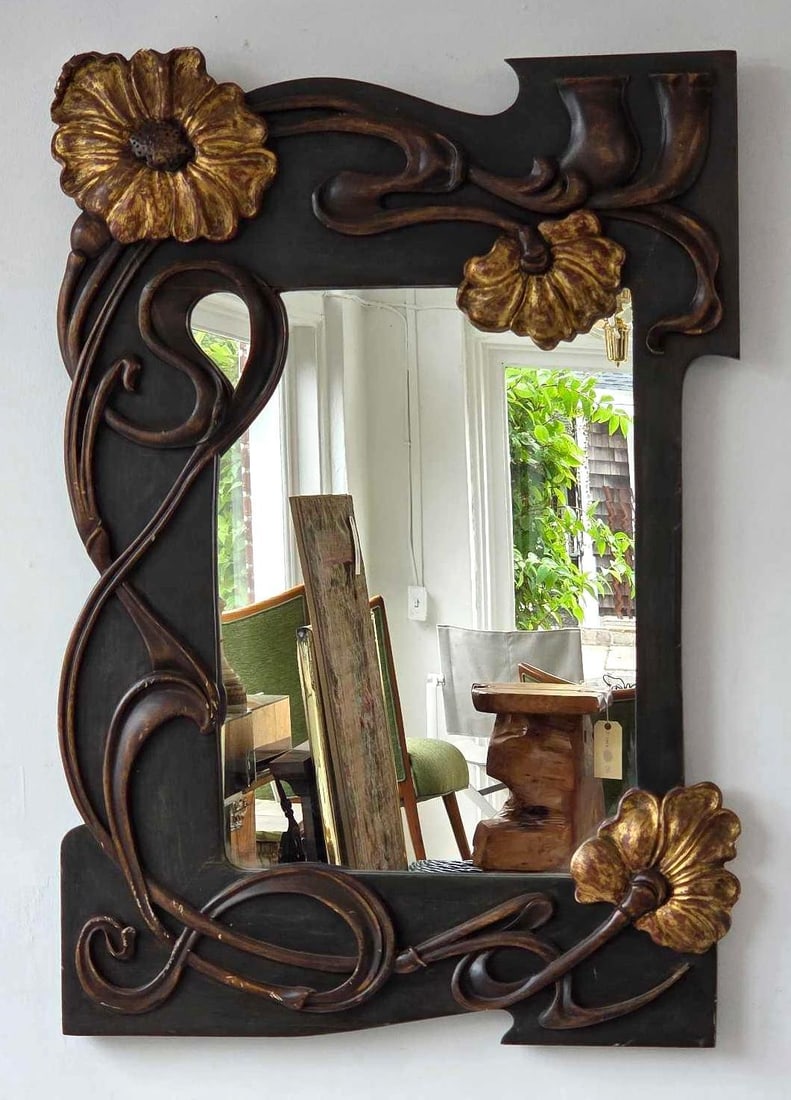 ART NOUVEAU CARVED WOOD AND GESSO MIRROR WITH GILT ACCENTS: An Art Nouveau wall mirror Approximate Dimensions: 31.5" H x 21.75" W Artist or Maker: Unknown Provenance: From a New York Collector Notes: Although care is taken to photograph and