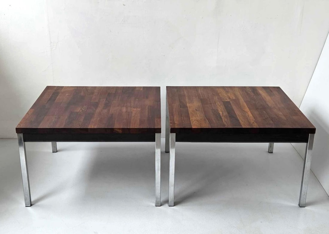 PAIR OF MID CENTURY ROSEWOOD AND CHROME SIDE TABLES BY DAVID PARMELEE FOR FOUNDERS: A pair of mid century side tables with book matched rosewood tops over ebonized aprons, raised on flat chromed steel legs Approximate Dimensions: 16.25" H x 26" W x 25.75" D Artist or