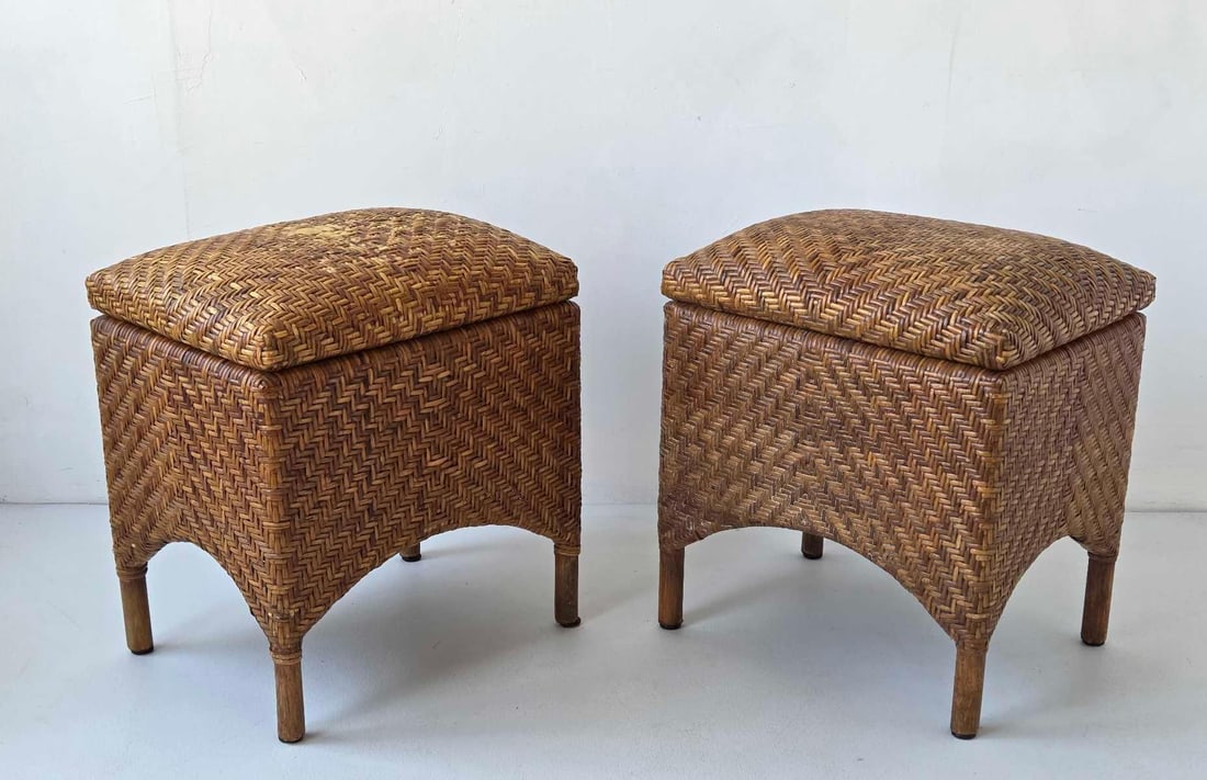 PAIR OF VINTAGE HERRINGBONE WOVEN RATTAN STORAGE OTTOMANS/STOOLS: Pair of herringbone woven rattan storage ottomans/stools Approximate Dimensions: 19" H X 17" W X 13.25" D Artist or Maker: Unknown Provenance: From a New York Collector Notes: Although car