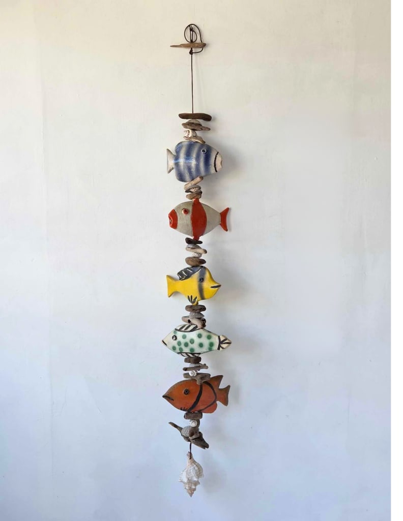 FOLK ART CERAMIC FISH GARLAND ON ROPE: hanging garland of glazed ceramic fish, driftwood and shell elements on rope Approximate Dimensions: 58"L Artist or Maker: Unknown; folk art Provenance: From a New York Collector Notes: Although c