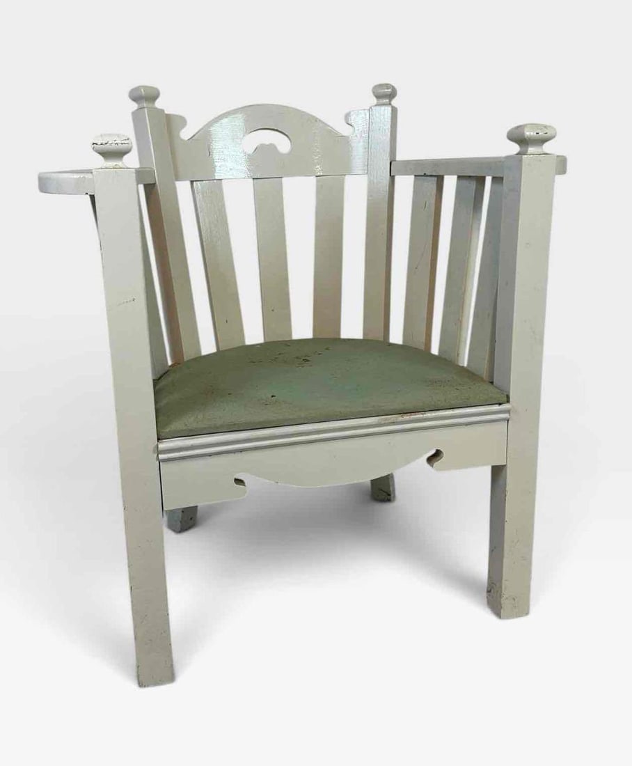 PAINTED ARTS AND CRAFTS SLAT BACK BARREL ARMCHAIR WITH PIERCED CREST RAIL: painted Arts and Crafts armchair with curved slat back, pierced and shaped crest rail, turned finials, square tapered legs and a green covered seat Approximate Dimensions: 33" x 24" x 36" 