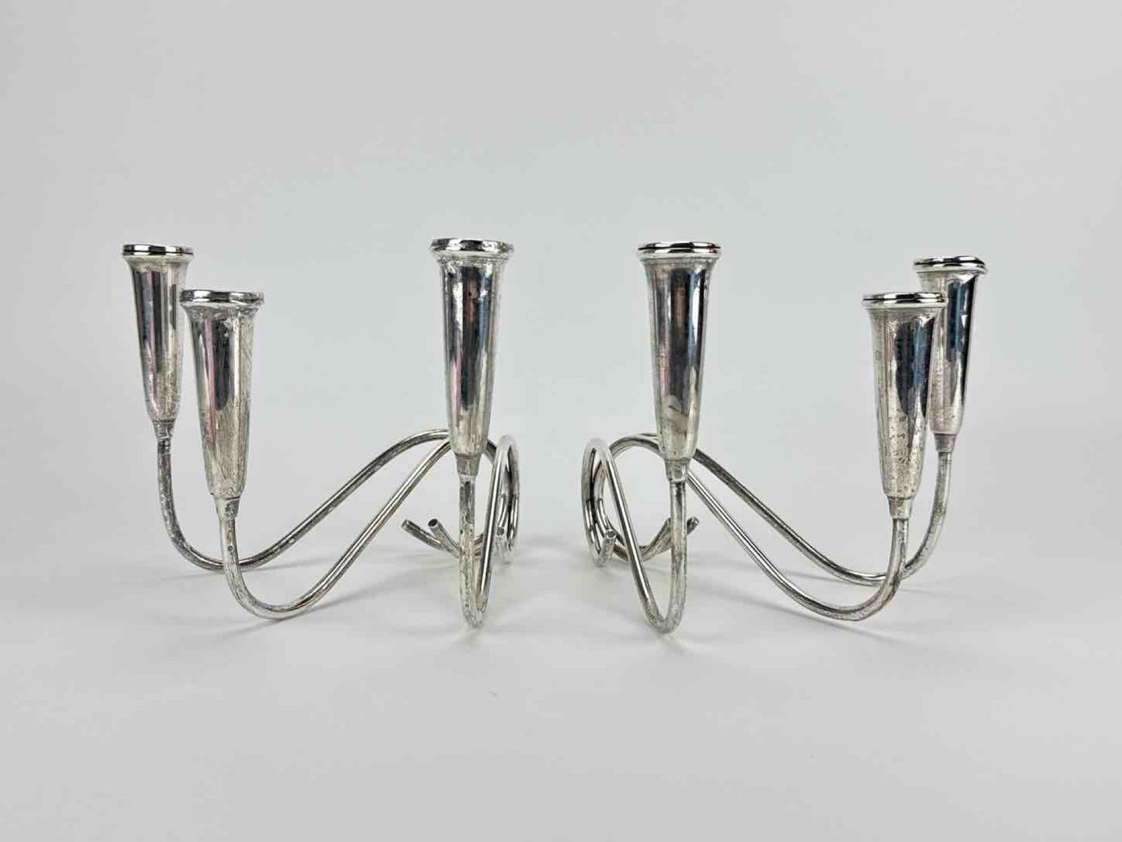 PAIR VINTAGE WEIGHTED STERLING SILVER TWIN ARM CANDELABRA: pair of sterling silver two-light candelabra Approximate Dimensions: 6" H X 7.25" W X 8" D; 23.090 Ozt. Artist or Maker: Unknown; marks not visible in photos A New York Gallerist and Colle