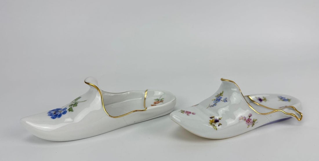 TWO 19TH CENTURY MEISSEN SLIPPERS: Two 19th century Meissen porcelain slippers Approximate Dimensions: taller 2 1/2 in. H x 2 1/2 in. W x 7 in. D (as recorded) Artist or Maker: Meissen Provenance: From a New York Collector Notes:<