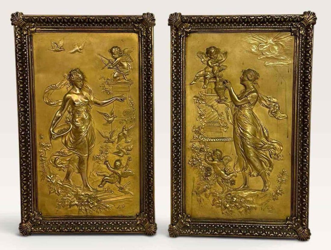 PAIR OF GILT BRONZE RELIEF PANELS, CLASSICAL MAIDENS WITH PUTTI AND BIRDS, FRAMED: Pair of upright rectangular relief panels, each modelled in low relief with a classical maiden in flowing drapery among flying birds, winged putti and garden ornament, gilded overall and set in ornate