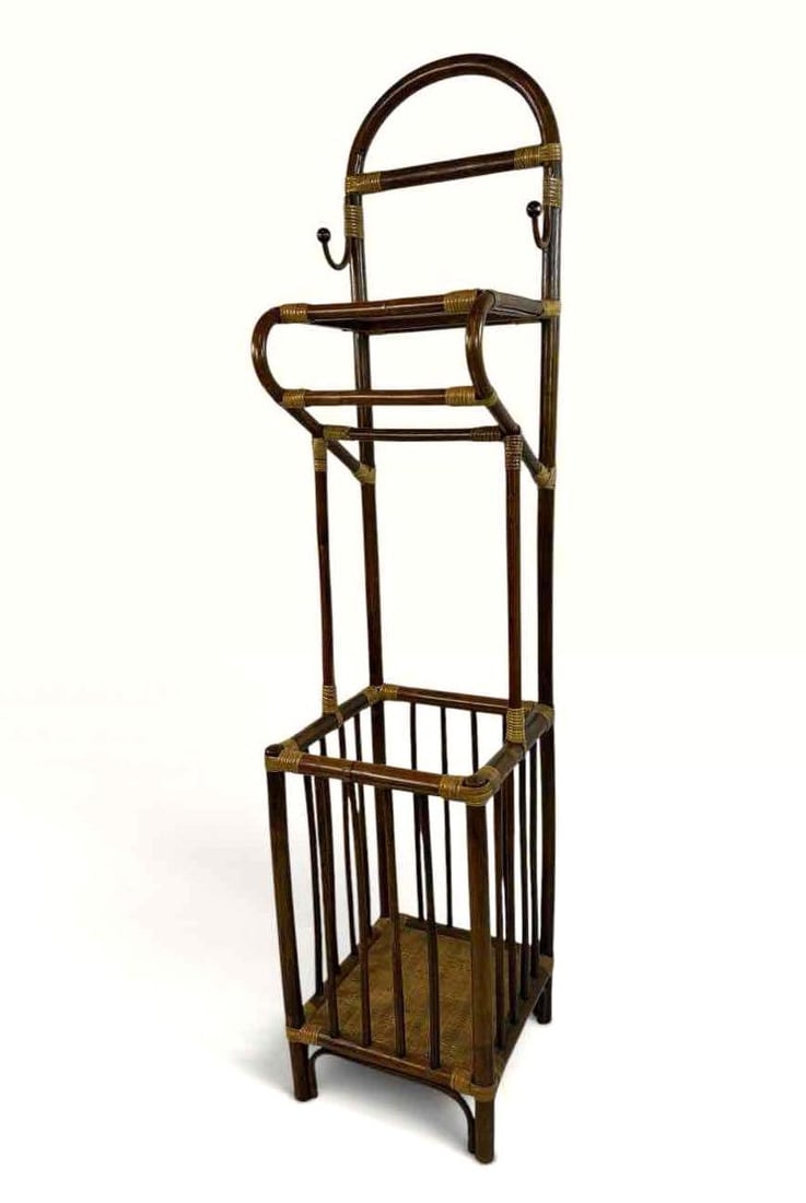 VINTAGE BAMBOO AND RATTAN VALET STAND WITH UMBRELLA BOX BASE, 65 IN. TALL: Tall narrow valet stand in bamboo with rattan bound joints. Approximate Dimensions: 65 "H x 15 "W x 15 "D Artist or Maker: Unknown Provenance: From a New York Collector Notes: Although care is taken t
