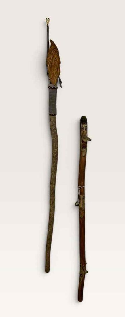 TWO HAND CARVED FOLK ART WALKING STICKS: Two hand carved walking sticks. Approximate Dimensions: 2" x 2" x 56" Artist or Maker: Unknown Provenance: From a New York Collector