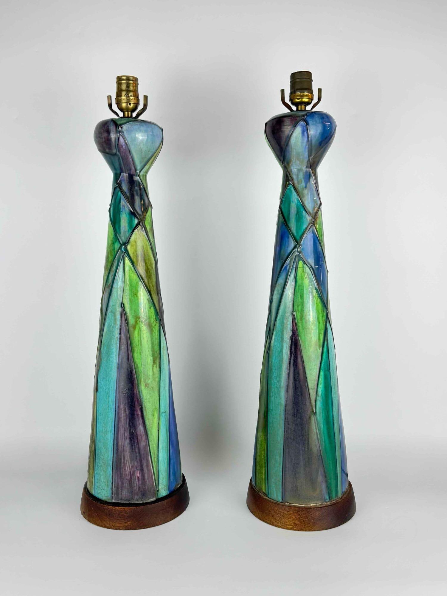 PAIR OF TALL MID CENTURY MODERN POLYCHROME GLAZED CERAMIC TABLE LAMPS: Pair of tall conical glazed ceramic table lamps Approximate Dimensions: 26" H x 6.75" Dia. Artist or Maker: Unknown Provenance: From a New York Collector Notes: Although care is taken to