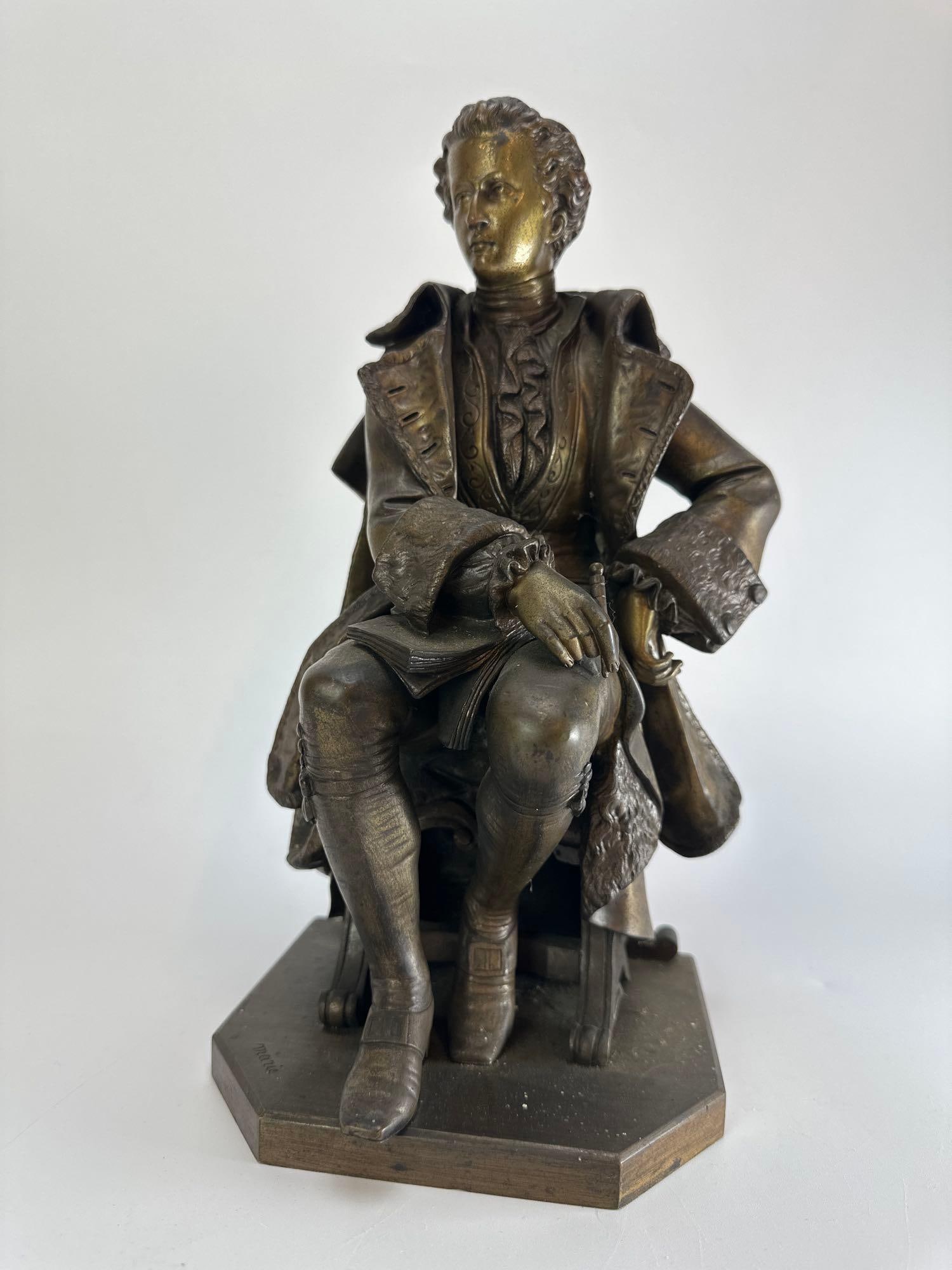 DESIRE PIERRE LOUIS MARIE BRONZE FIGURE OF A SEATED 18th CENTURY GENTLEMAN: Cast metal figure of a seated gentleman in eighteenth century dress with books at his feet, on a shaped canted plinth Approximate Dimensions: 12.5" H x 6.25" W x 6" D Artist or Maker: Desi